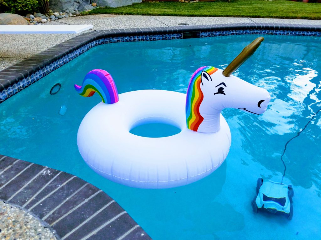 Unicorn pool floatie in the pool